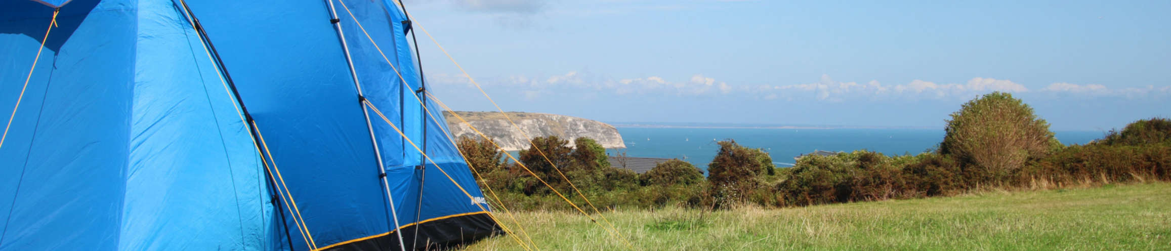 Swanage Coastal Heights summer camping field with sea views