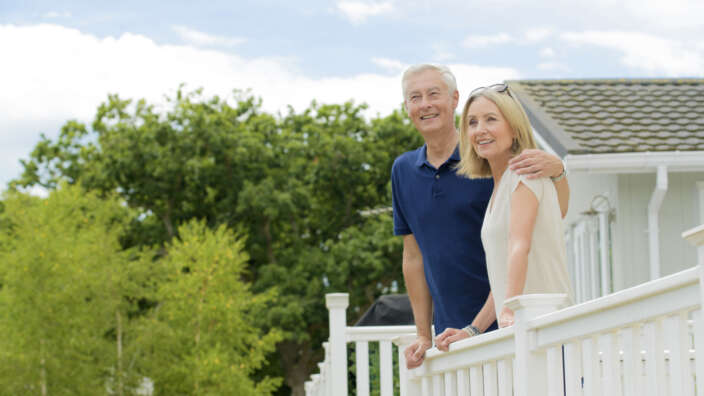 Couple Decking Smiling Summer Sale