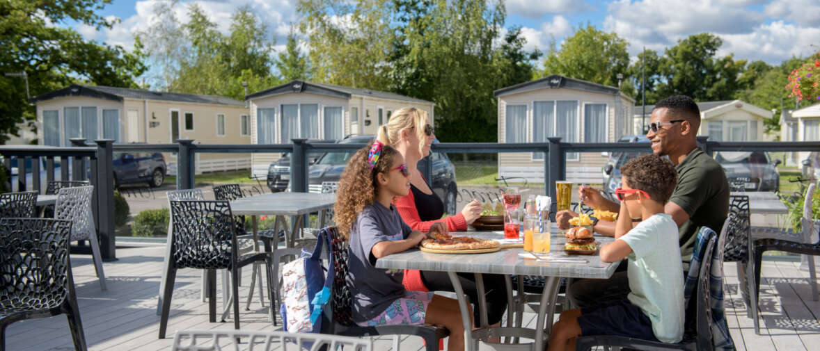 Oakdene family eating on terrace